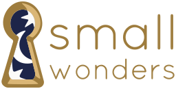 Small Wonders logo featuring a keyhole with stars and a moon